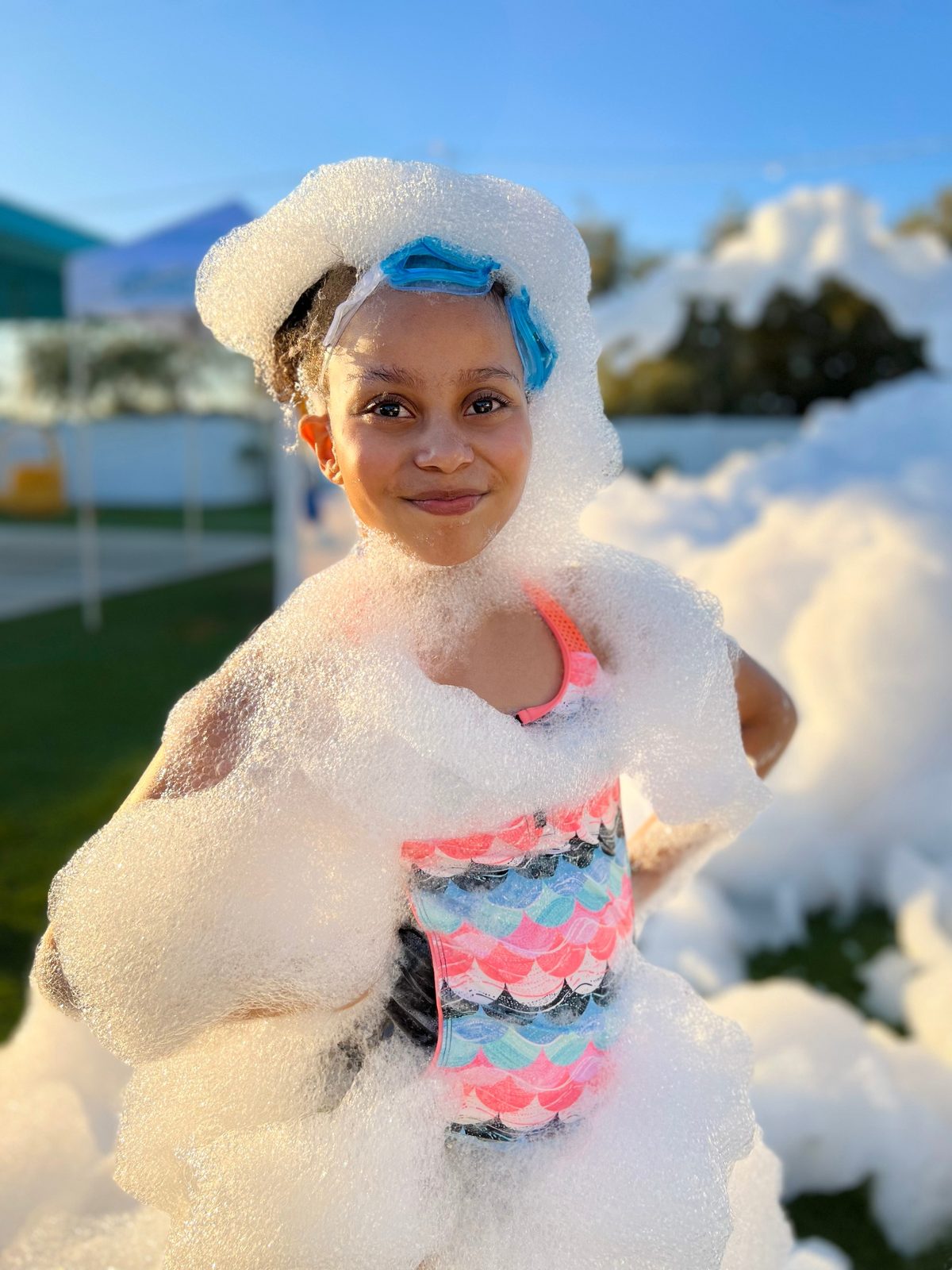 Girl with goggles in foam