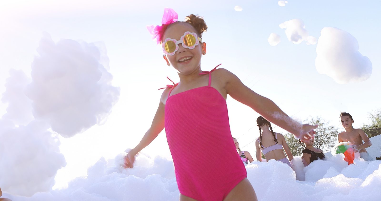 Girl in pink at foam party